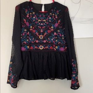 Black embroidered blouse.